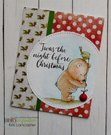 Red polka-dot card with the bear holding an ornament inside a circle frame, 'Twas the night before Christmas' in script.