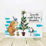 White card with the bear and pup by a teal-and-green tree, blue cloud accents behind them.