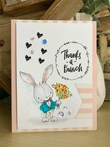 Card with the bunny in a teal jacket holding a yellow and red bouquet beside the 'Thanks -a- Bunch' wreath, little black hearts and pink striped borders