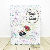 Card with the bunny in a black tuxedo and red bow tie holding a pink bouquet over pink, purple and teal splatters with the 'Thanks -a- Bunch' wreath