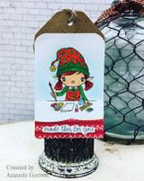 Kraft tag card with the elf colored in a red and green hat, mounted over a red 'made this for you' strip.
