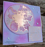 Soft lilac and pink card with the flower gold-embossed on a large circle and the block sentiment heat embossed on a small panel.