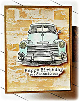 Card with the barn-wall texture behind a vintage teal car: 'Happy Birthday to a classic guy.'