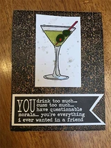 The denim texture as a dark card panel behind a green cocktail-glass image.