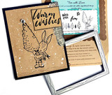 Kraft card with the bunny and a pine tree stamped in black with white paint splatter, 'Warm Wishes' stamped at the top, photographed with the Tree with Love packaged stamp set.