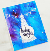 A white-embossed pine tree and bird banner on a blue-and-purple galaxy background, captioned "Holy night."