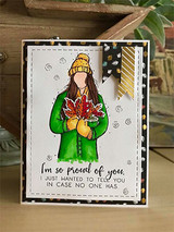 Card with the girl in a green coat holding autumn leaves, 'I'm so proud of you.'