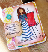 Floral card with Abby in a blue top and blue and white chevron skirt beside a red canvas on her easel, and the FUTURE sentiment on a kraft label