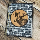 Card of the moose head in a circle over a 'merry christmas' text background.