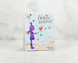 Soft card with the winter girl and a bird in flurries, stamped 'Warm Wishes.'