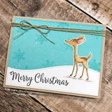 Aqua snowflake card with a white snow bank die cut and twine bow, a single fawn coloured in soft tan and a script merry Christmas greeting.