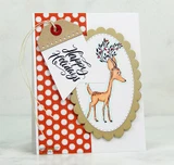 Red and white polka dot tag card with a kraft scalloped oval, a fawn coloured in tan and a small white tag stamped "Happy Holidays".