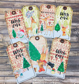 Seven tags stamped with the fair isle background in soft red and green, each layered with hand colored deer, rabbits, trees and with love or winter wishes labels.