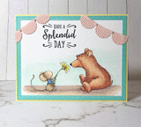 Card with the bear and mouse colored warmly under a striped awning, 'have a Splendid Day.'