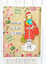 Kraft card with sweater-print paper and Merry Girl in a red coat standing in snow, beside 'WISHING YOU ALL THE JOYS OF THE SEASON.'