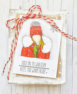 Red-and-white twine card of the cozy girl with 'Hold on to whatever keeps you warm inside.'