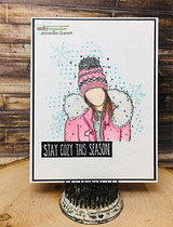 Snowy card of the winter girl with 'STAY COZY THIS SEASON.'