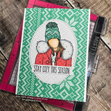 Green knit-pattern card of the cozy winter girl with 'STAY COZY THIS SEASON.'