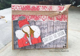 Fold-out card of the winter girl with 'STAY COZY THIS SEASON.'