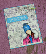 Plum card of the cozy girl in a blue knit hat with 'STAY COZY THIS SEASON.'