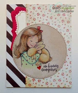 Card on floral and black-striped papers with the girl and her bunnies in a kraft circle, stamped 'no bunny compares.'