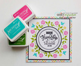 Pastel plaid card with stamped floral wreath circling 'our friendship is like a circle' sentiment