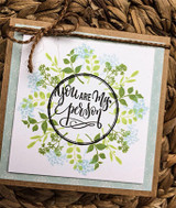 Kraft card with airy blue floral wreath circling 'you are my person'