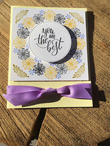 Yellow and black dandelion wreath card with 'you are the best' center and purple ribbon