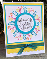 Bright multicolor floral wreath on teal-framed yellow card. You are my person.