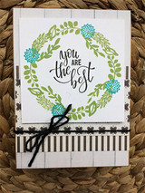 Green wreath with aqua flower accents — you are the best, black bow