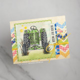 Green vintage tractor, 'OLDER BUT WISER,' on patchwork gingham papers.