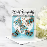 Card with copper-and-teal butterflies and 'With Sympathy — Wishing you peace in the midst of sorrow.'