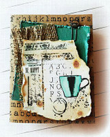 Kraft card layered with burlap and teal ribbon over an alphabet background, topped by a torn collage panel with a teal coffee mug, a coffee ring and the words 'BE HAPPY'.