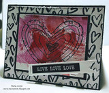 Mixed-media card with the scribbled heart stamped over a pink and grey painted panel, a hand-drawn heart border, and a black love love love banner.