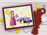 Bright card with yellow dots on a white panel, the girl in a magenta dress holding a yellow balloon and cake, photographed beside a red rubber die and a large script birthday greeting.
