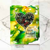Card with the butterfly-filled heart stamped in black over a green and yellow alcohol ink panel, sentiment "Make your heart the most beautiful thing about you."