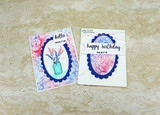 Two small cards with the rose background in blue and pink, 'hello' and 'happy birthday.'