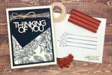 Card with the rose background on navy, 'Thinking of You.'