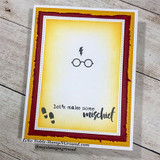 Deep red framed card with glasses and lightning bolt, 'let's make some mischief'