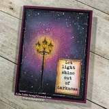 Deep purple and navy night sky card with white splatter stars, the street lamp glowing in gold at the center and a framed panel reading Let light shine out of darkness.