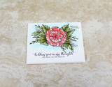 Delicate card with a small pink-green bloom and 'holding you in my thoughts and hoping you are doing ok.'