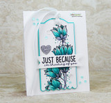 White tag-style card with the bellflowers colored teal and blue, 'JUST BECAUSE' in bold block letters.