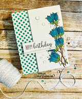Green polka-dot card with the bellflowers colored blue and a 'Happy Birthday' banner across the panel.