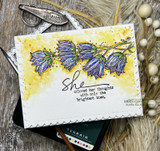 Yellow-washed card with the bellflowers in soft purple and a script sentiment about bright hues.