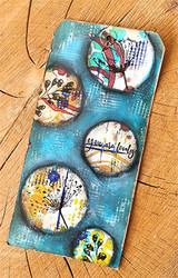 Textured teal tag with round window accents and painted sketch florals.
