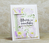 Card with airy pastel sketch flowers and 'Never stop making wishes.'