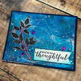 A leaf sprig colored on a deep blue mixed-media card with a 'you're so thoughtful' banner.