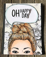 Card with the blonde messy-bun girl over grey floral paper and a speech bubble reading 'OH happy day'
