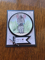 Card with the zebra in a circle over a soft lavender dotted background.