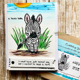 Card with the zebra in tall grass and 'a happy hello' on a bright sky panel.